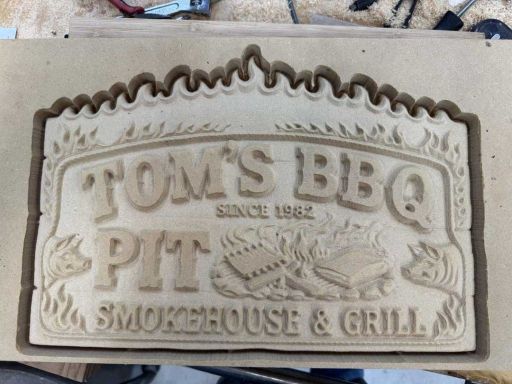 Toms BBQ Sign Carving