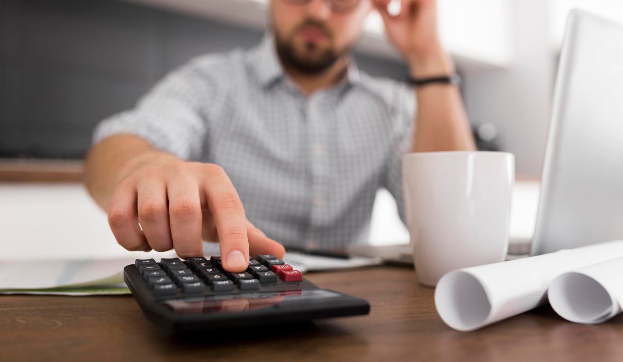 A man calculating expenses