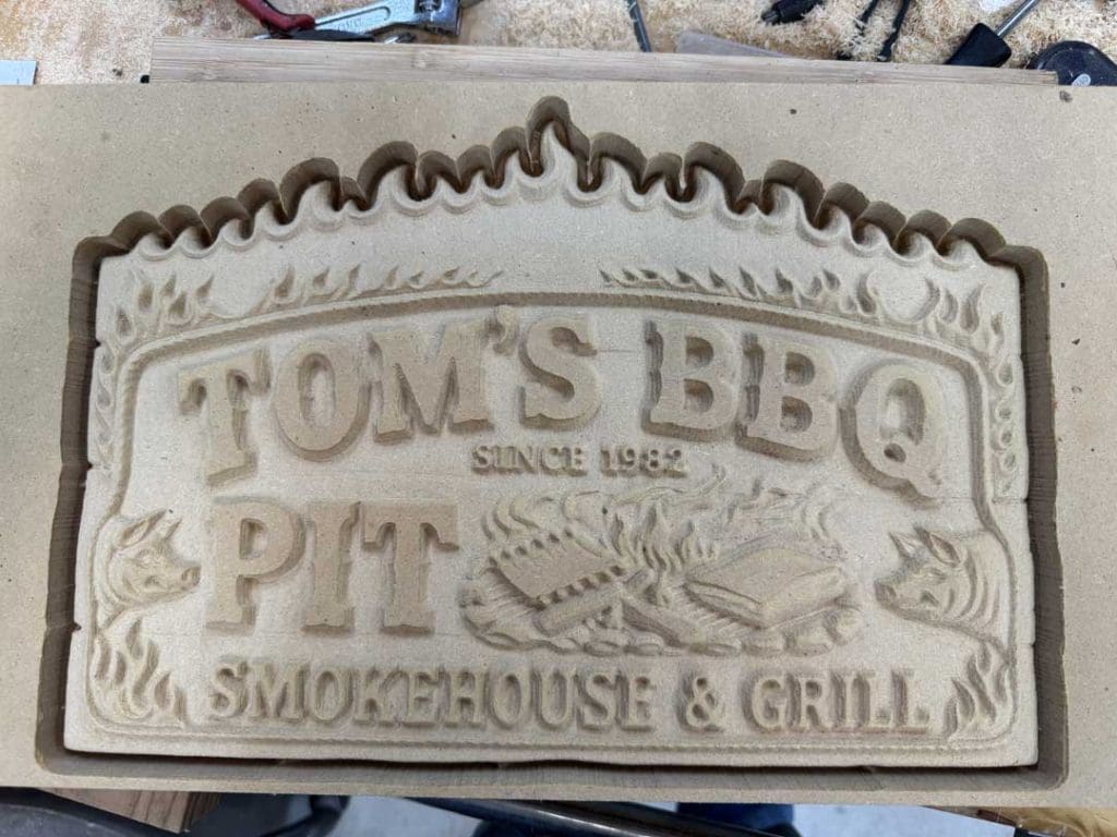 Toms BBQ Sign Carving